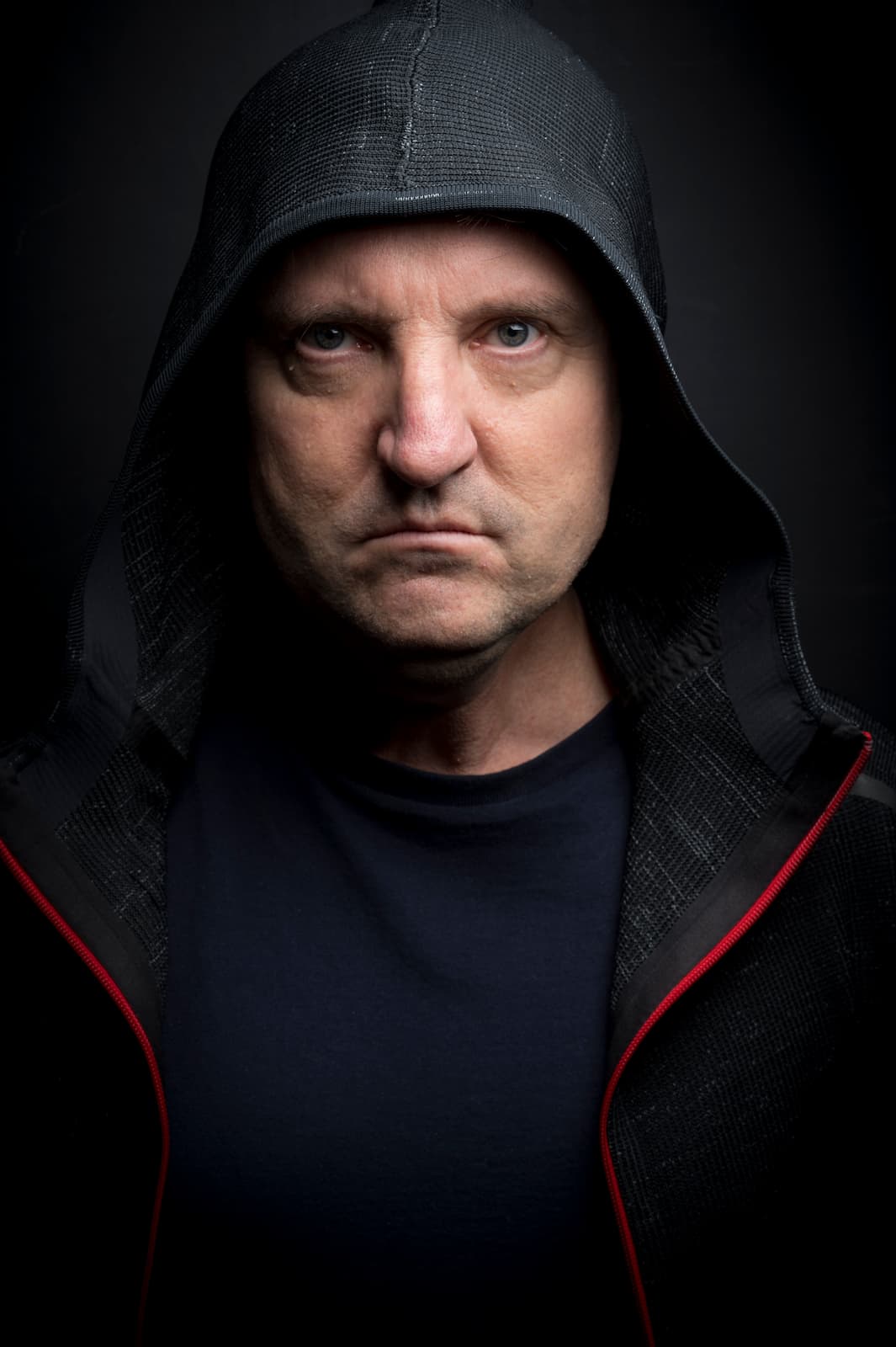 Tommy Lentsch hooded look with dramatic lighting